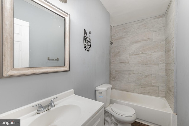 full bathroom with vanity, tiled shower / bath combo, and toilet