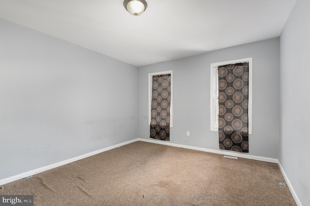 spare room with carpet flooring