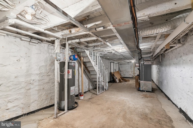 basement with electric water heater and heating unit