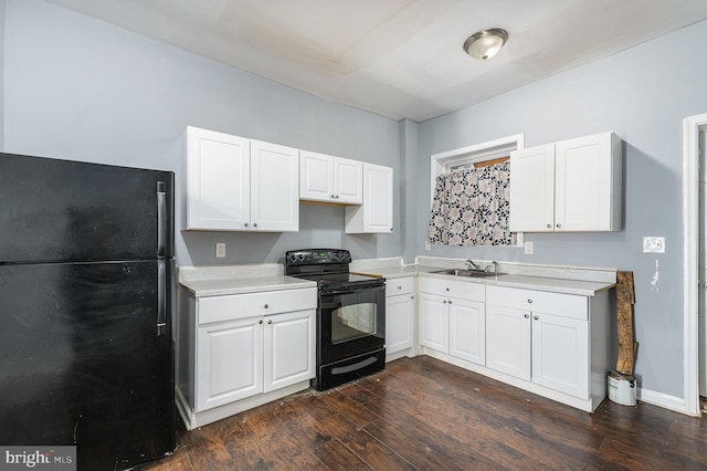 kitchen with white cabinetry, sink, dark hardwood / wood-style flooring, and black appliances