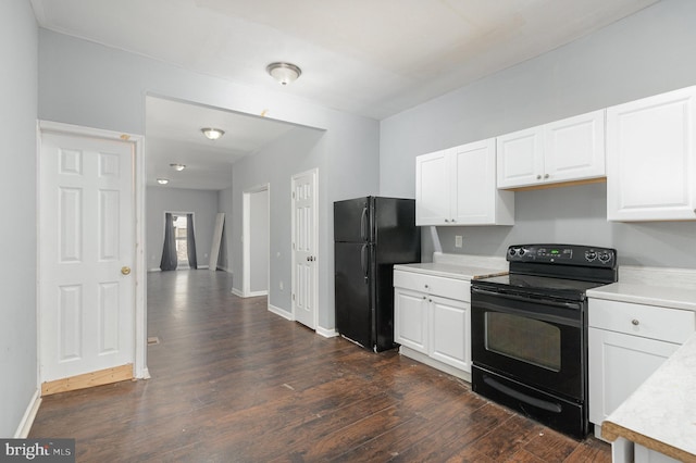 kitchen featuring white cabinets, dark hardwood / wood-style floors, and black appliances