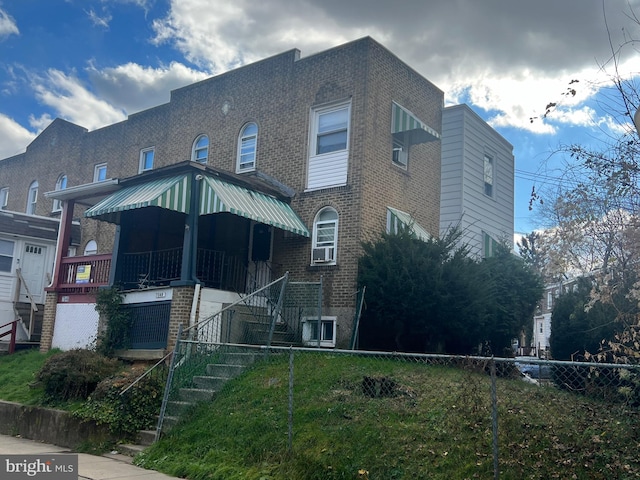 back of property with covered porch