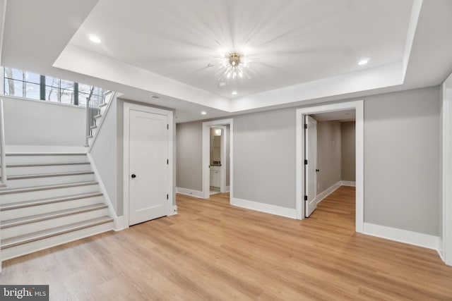 basement featuring light wood-type flooring