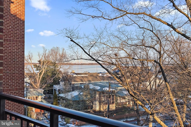 balcony featuring a water view