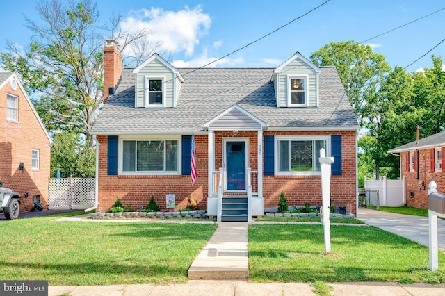 view of front of property with a front lawn