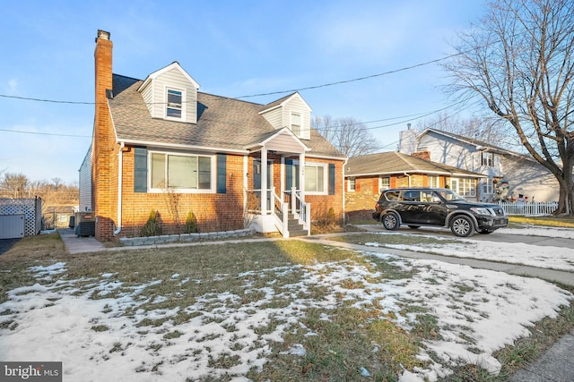 new england style home featuring central air condition unit