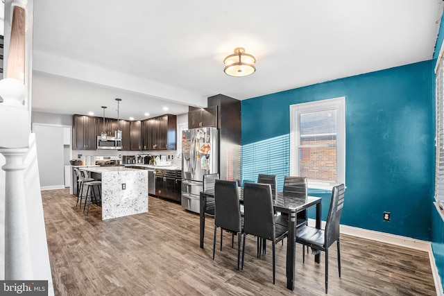 dining space featuring light wood-type flooring