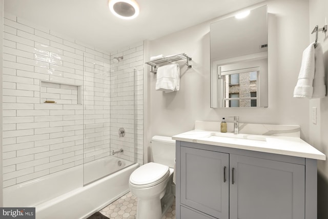 bathroom with toilet, vanity, and shower / bathing tub combination