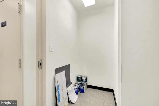 interior space featuring baseboards and tile patterned floors