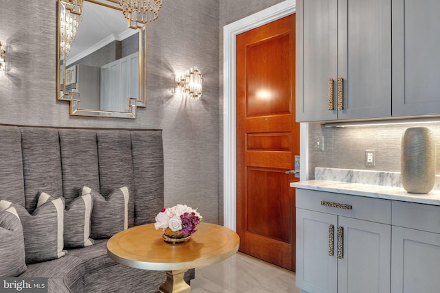 interior space featuring an inviting chandelier and ornamental molding