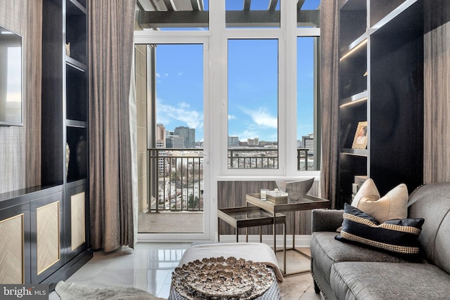 living room featuring floor to ceiling windows