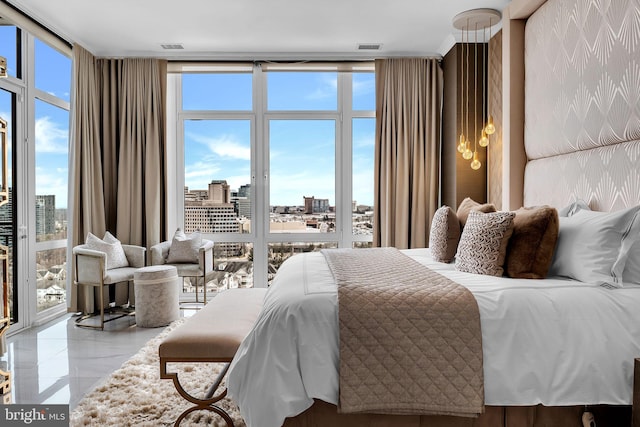 bedroom with floor to ceiling windows