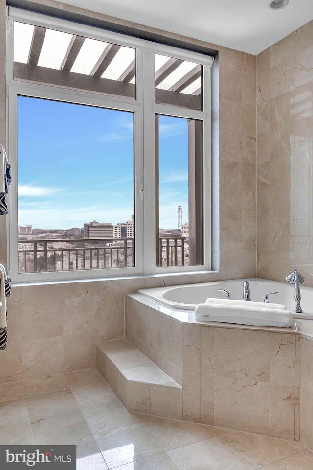 bathroom featuring a relaxing tiled tub