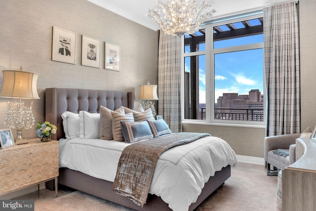 bedroom featuring crown molding and an inviting chandelier