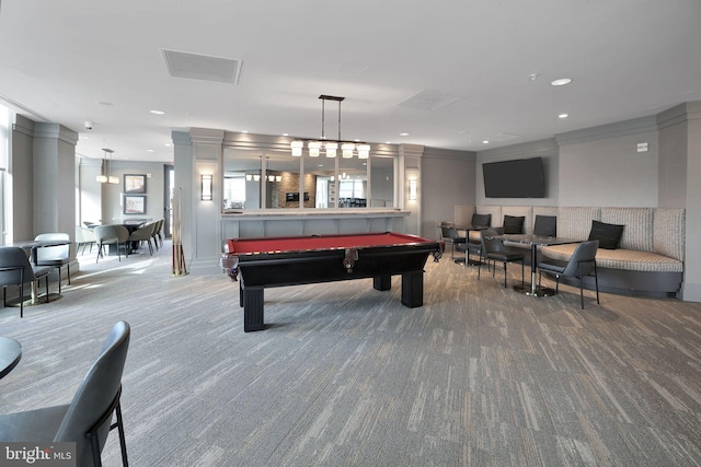 recreation room with billiards, ornamental molding, and carpet