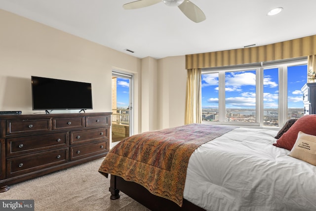 bedroom featuring ceiling fan and light carpet