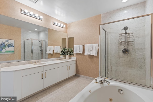 bathroom with vanity and separate shower and tub