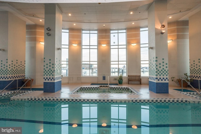 view of pool featuring an indoor hot tub