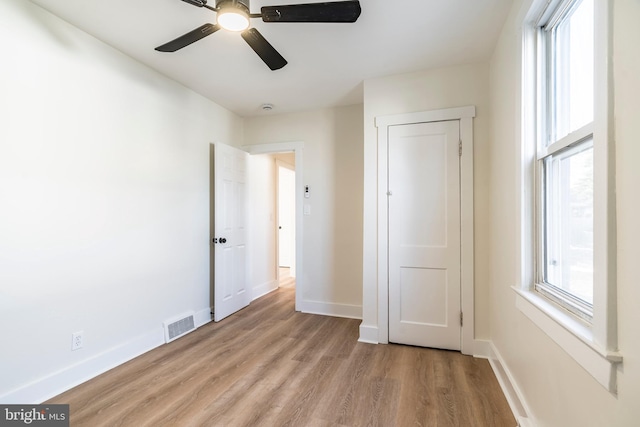 unfurnished bedroom featuring ceiling fan and light hardwood / wood-style floors