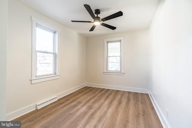 unfurnished room with ceiling fan and light hardwood / wood-style floors