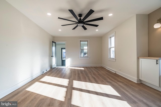 spare room with ceiling fan and light hardwood / wood-style floors