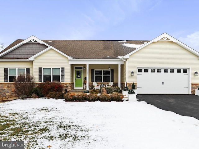 view of front of home featuring a garage and covered porch