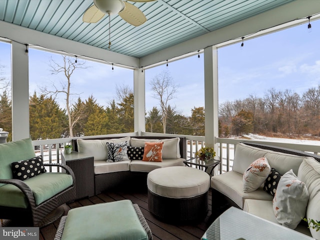 sunroom with ceiling fan and a wealth of natural light