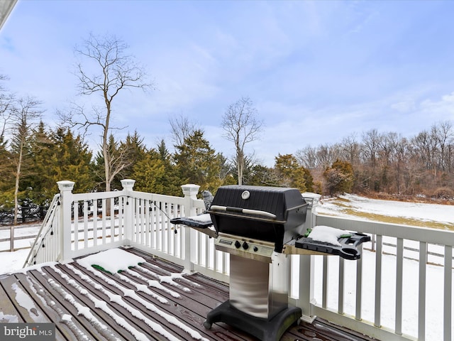 snow covered deck with grilling area