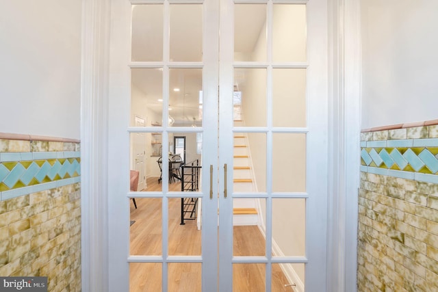 interior details featuring hardwood / wood-style floors and french doors