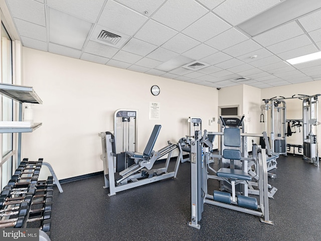 exercise room with a drop ceiling