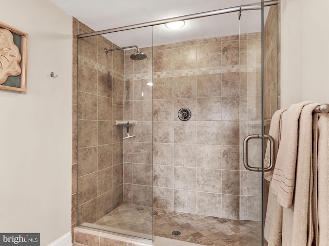 bathroom featuring radiator heating unit and walk in shower