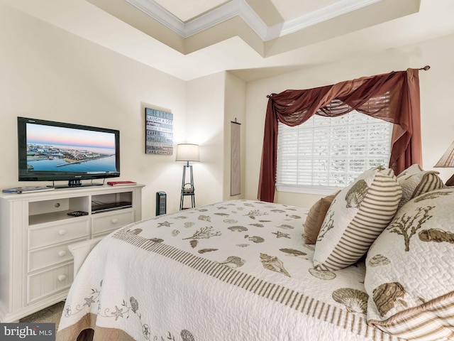 bedroom featuring ornamental molding and carpet flooring