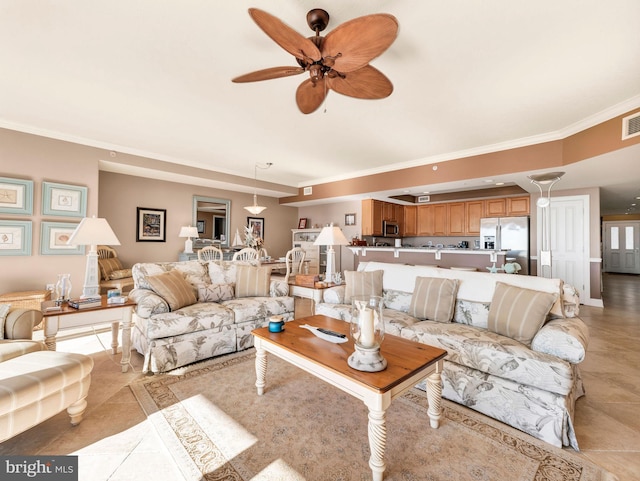 living room featuring ceiling fan and crown molding