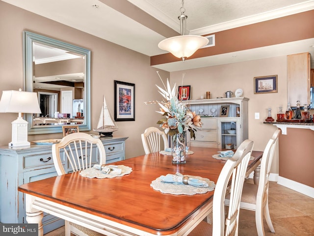 dining space featuring ornamental molding