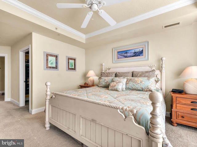 bedroom featuring ceiling fan, light carpet, and crown molding