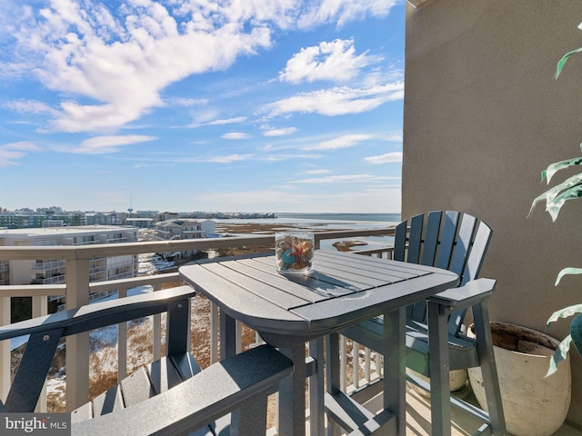 balcony featuring a water view