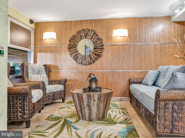 living area with wooden walls