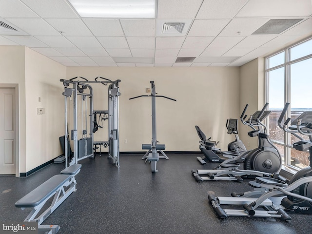 workout area with a paneled ceiling