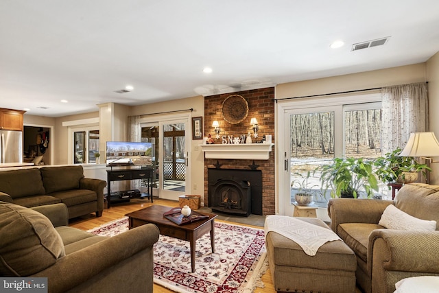 living room with plenty of natural light and light hardwood / wood-style floors