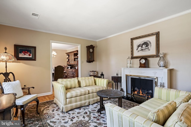 living room featuring hardwood / wood-style flooring and ornamental molding