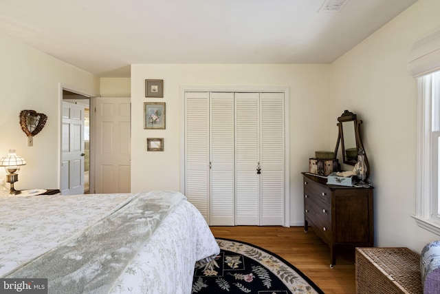 bedroom featuring a closet and light hardwood / wood-style flooring