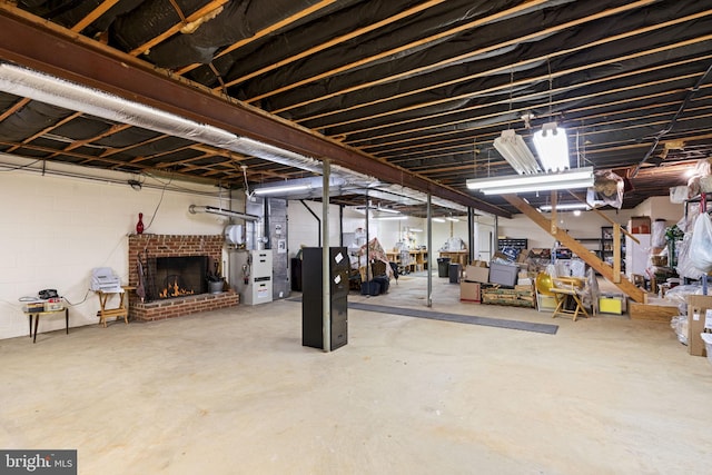 basement featuring a brick fireplace