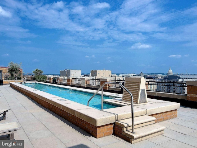 view of pool featuring a patio area