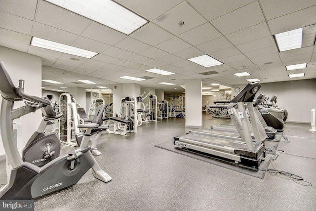 exercise room with a paneled ceiling