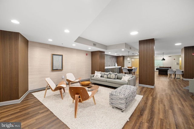 living room featuring dark hardwood / wood-style floors and billiards