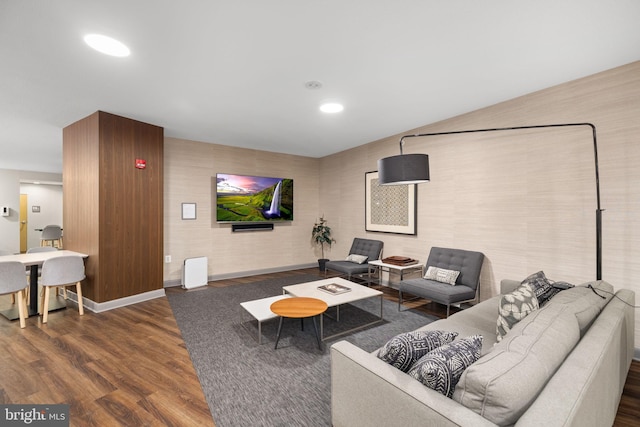 living room with dark hardwood / wood-style flooring