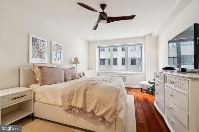 bedroom with wood-type flooring and ceiling fan