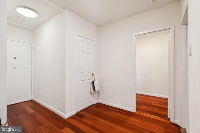 hall featuring dark hardwood / wood-style floors