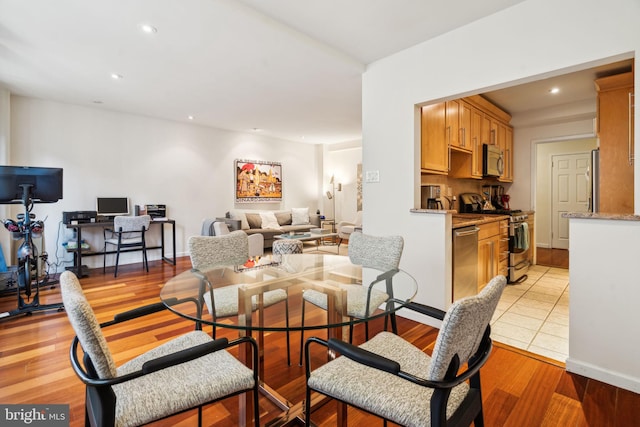 dining room with light hardwood / wood-style flooring