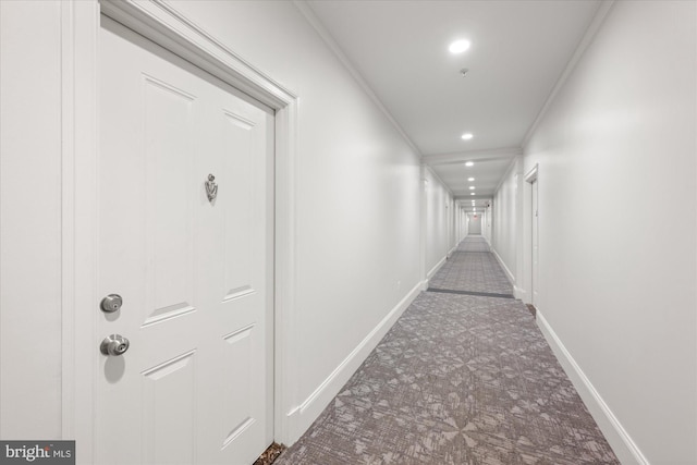 hallway featuring crown molding